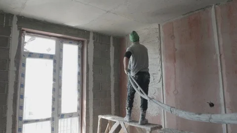 Worker apply plaster on the wall in pandemic Stock Footage 130049000