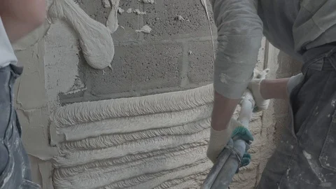 Worker apply plaster on the wall in pandemic Stock Footage 130049707