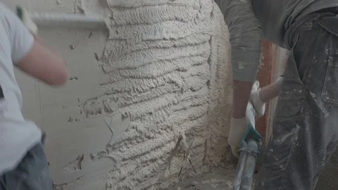 Worker apply plaster on the wall in pandemic Stock Footage 130049782