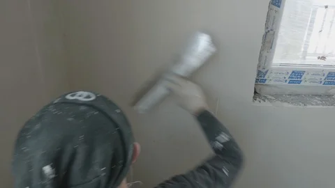 Worker apply plaster on the wall in pandemic Stock Footage 130049934