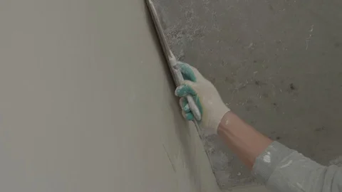 Worker apply plaster on the wall in pandemic Stock Footage 130049952