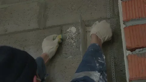Worker apply plaster on the wall in pandemic 14.05.2020 Stock Footage 130426028