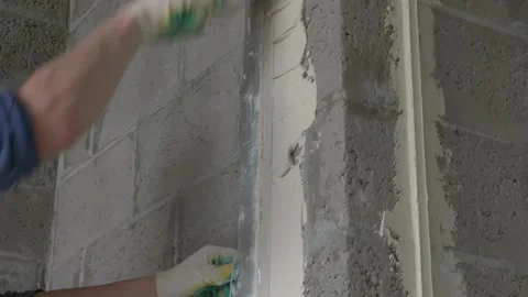 Worker apply plaster on the wall in pandemic 14.05.2020 Stock Footage 130426110