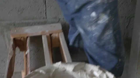 Worker apply plaster on the wall in pandemic 14.05.2020 Stock Footage 130426191