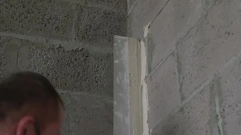 Worker apply plaster on the wall in pandemic 14.05.2020 Stock Footage 130426203