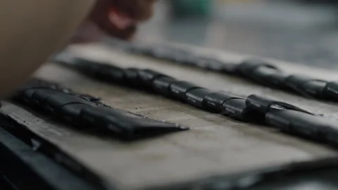 Worker Applying Adhesive to Leather Shoe Parts on Factory Workbench Close Up Stock Footage 341667875