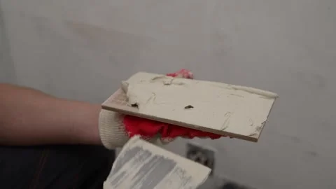 Worker Applying Adhesive to Tile Stock Footage 333528473
