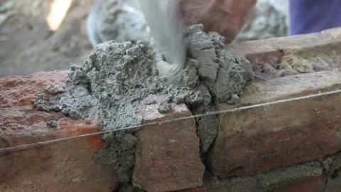 Worker applying mortar Stock Footage 332588038