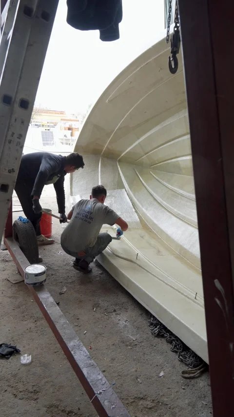 Worker Applying Resin to Composite Boat Hull, Turkey, Nov 19, 2025 Stock Footage 323180980