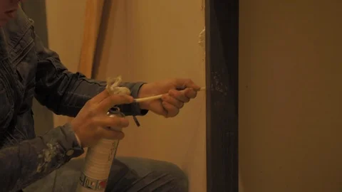 Worker applying silicone sealing with caulking gun for moisture protection on Stock-Footage 110771560