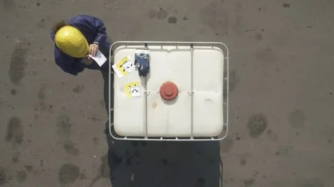 Worker applys labels to a white bulk 스톡 동영상 79162272