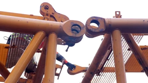 Worker ar crane at the construction site of the coal-fired power station Stock Footage 137571702