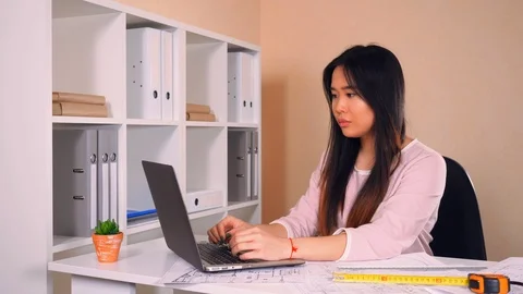 Worker in architectural bureau using computer Stock Footage 88334432