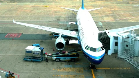 Worker are Loading luggage to the air port Gate Stock Footage 119187596