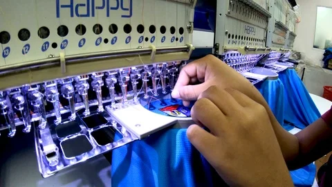 Worker are operate Embroidery Machine at Garment Manufacturers Stock Footage 106360526