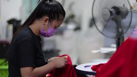  A worker are operate Embroidery Machine at textile Industry at Garment Manufact Stock Footage 254112690