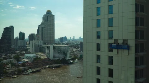 Worker are working outside the tall building in the city of civilite. Stock Footage 129310371