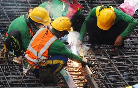 Worker are working with welding machine with out safty item in construction s Stock Photos