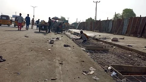 Worker Arranging Rods For Drainage Cover Roadside Kano Nigeria 動画素材 331304305