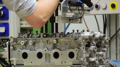 Worker assemble an automobile engine Video stock 73413638