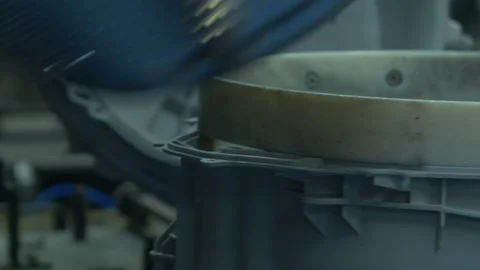 Worker assemble washing machine in factory Stock Footage 90022483