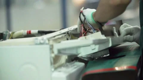Worker assembles a panel for a washing machine 스톡 동영상 162903298