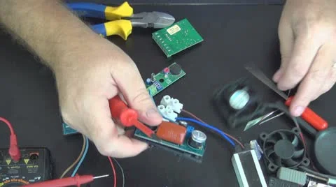 Worker Assembling an Electronic Board, Screwing  Stock Footage 12562639