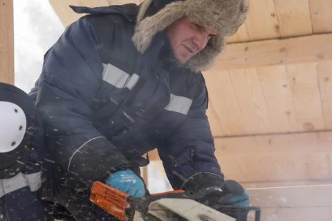 Worker assembling the frame of a wooden slide 写真素材
