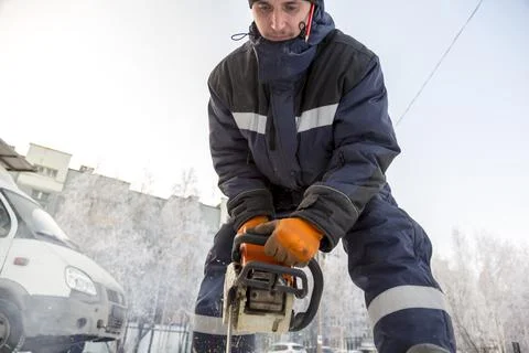Worker assembling the frame of a wooden slide 写真素材
