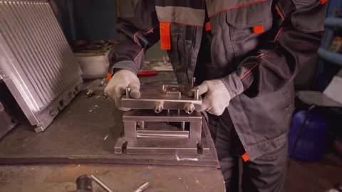 Worker Assembling Metal Parts in Workshop Stock Footage 272980522