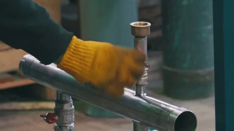 Worker Assembling Metal Water Supply Manifold with Wrench | Plumber Installing Stock Footage 343803150