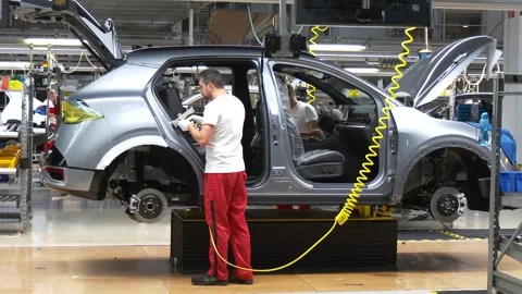 Worker Assembling Unfinished Vehicle in Car Factory Video stock 346230359