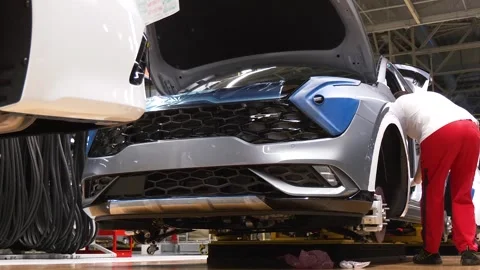 Worker Assembling Vehicle on Automotive Production Line Video stock 346229752
