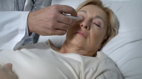 Worker of assisted living facility taking care of terminally-ill patient, help Stock Footage 119294788