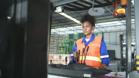 Worker in auto parts warehouse use a forklift to work Stock Footage 255272572