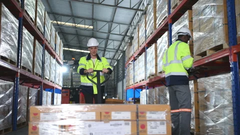 Worker in auto parts warehouse use a handcart to work Video stock 255273191