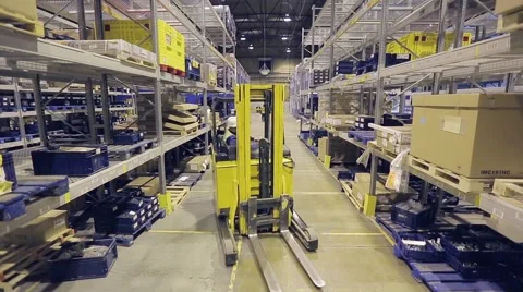 Worker on autoloader taking box from rack. Stock Footage 61136215