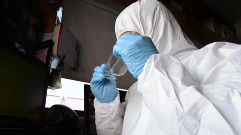 Worker in bacteriological protection suit at work Stock Footage 135536278