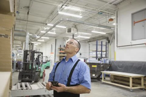 Worker with bar code reader working in warehouse Foto stock