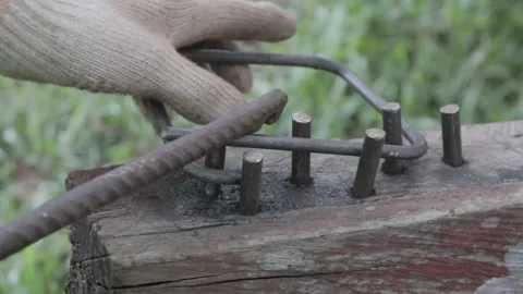 A worker is bending iron building materials Stock Footage 207481841
