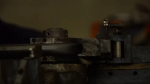 A worker bends a pipe on a special machine. Stock Footage 81250816