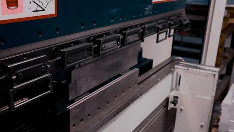 Worker bends sheet metal Stock Footage 127818331