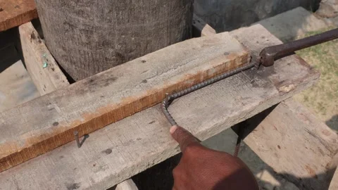 Worker bends steel reinforcement bars 스톡 동영상 332575468