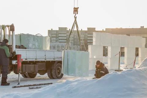 Worker in a black hat on unloading Fotos Stock