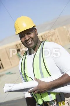 Worker With Blueprints At Site Stock Photos