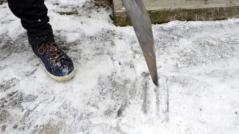 Worker breaking, cleaning the ice Stock Footage 99496146