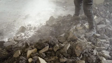 Worker Breaking Concrete with Sledgehammer - Manual Labor in Demolition Site Stock Footage 331998133