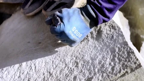 Worker Breaking Solid Rock Using Traditional Hand Tools Vidéo 339531127
