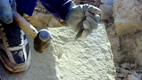 Worker Breaking Solid Rock Using Traditional Hand Tools Stockbeeldmateriaal 339531131