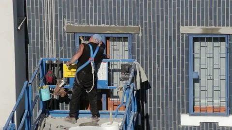 Worker brush it produced clinging to restore the window sill Stock Footage 49484665